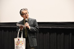 佐伯実行委員長のトークシーンの写真